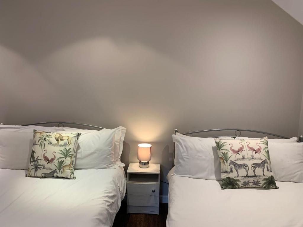 Un pat sau paturi într-o cameră la Cleadon