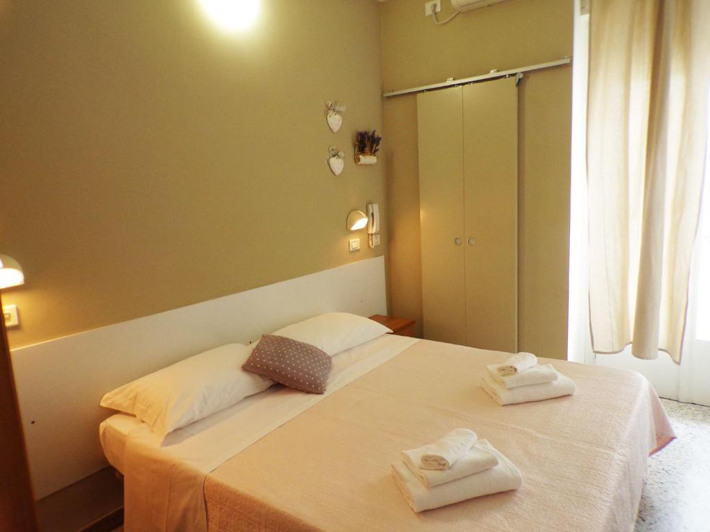 Postel nebo postele na pokoji v ubytování Hotel Graziella Mare