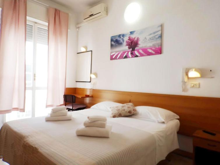 Postel nebo postele na pokoji v ubytování Hotel Graziella Mare