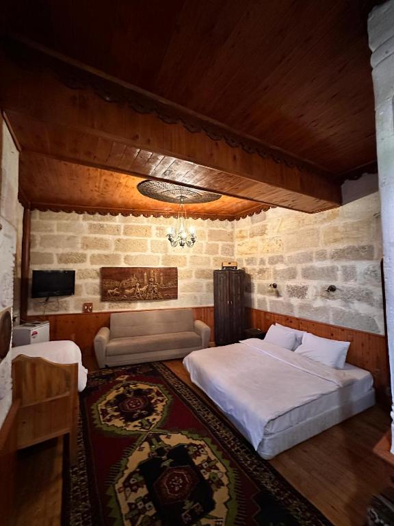 Postel nebo postele na pokoji v ubytování Tokmak Konukevi