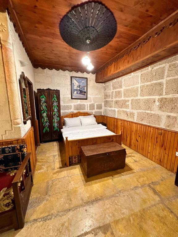 Postel nebo postele na pokoji v ubytování Tokmak Konukevi