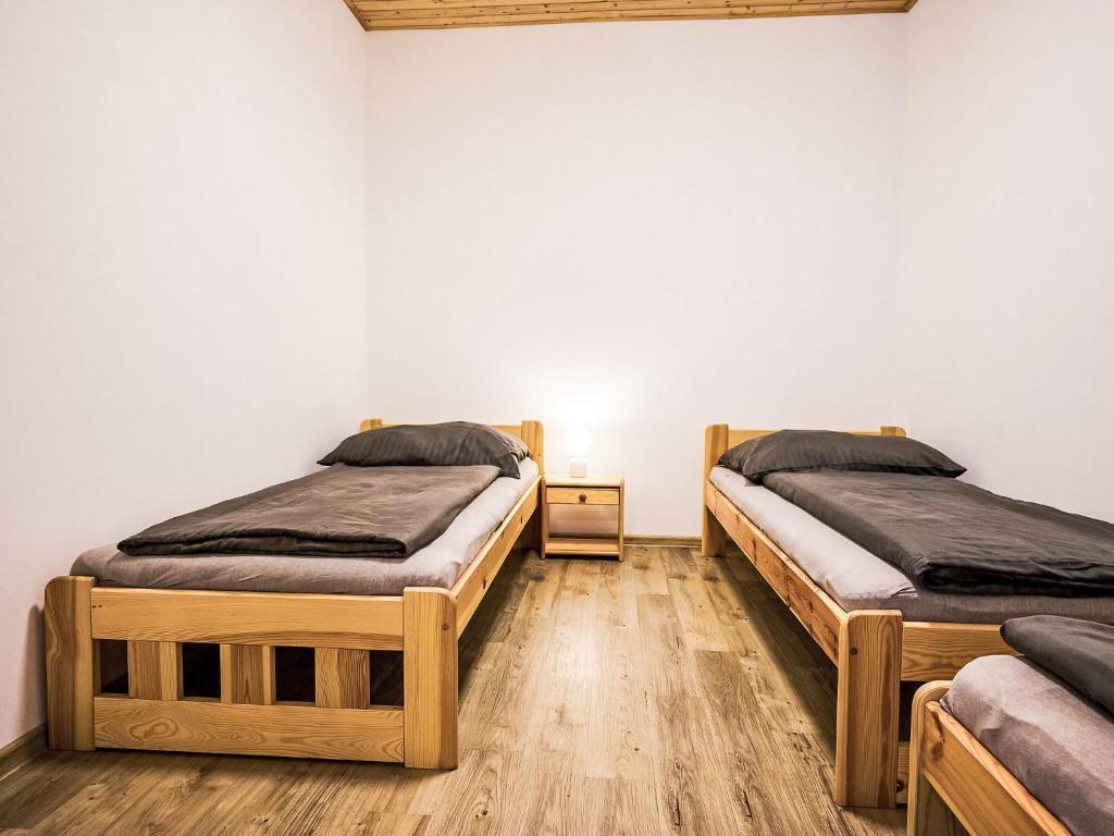 Postel nebo postele na pokoji v ubytování Apartment Pod Černou Studnicí-3 by Interhome