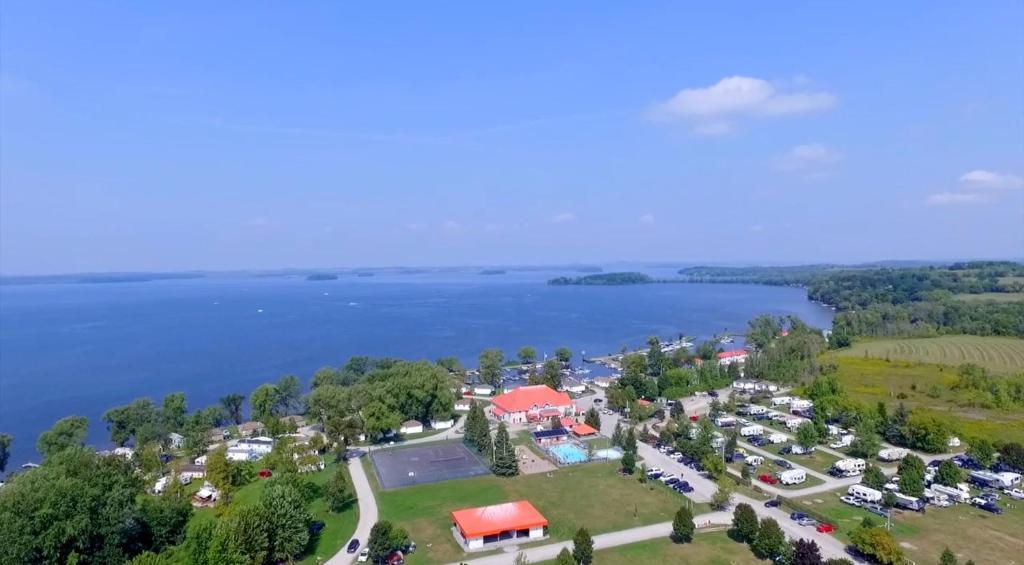 an aerial view of a park next to a lake at 3 Bedroom Waterfront Cottage 13 in Roseneath