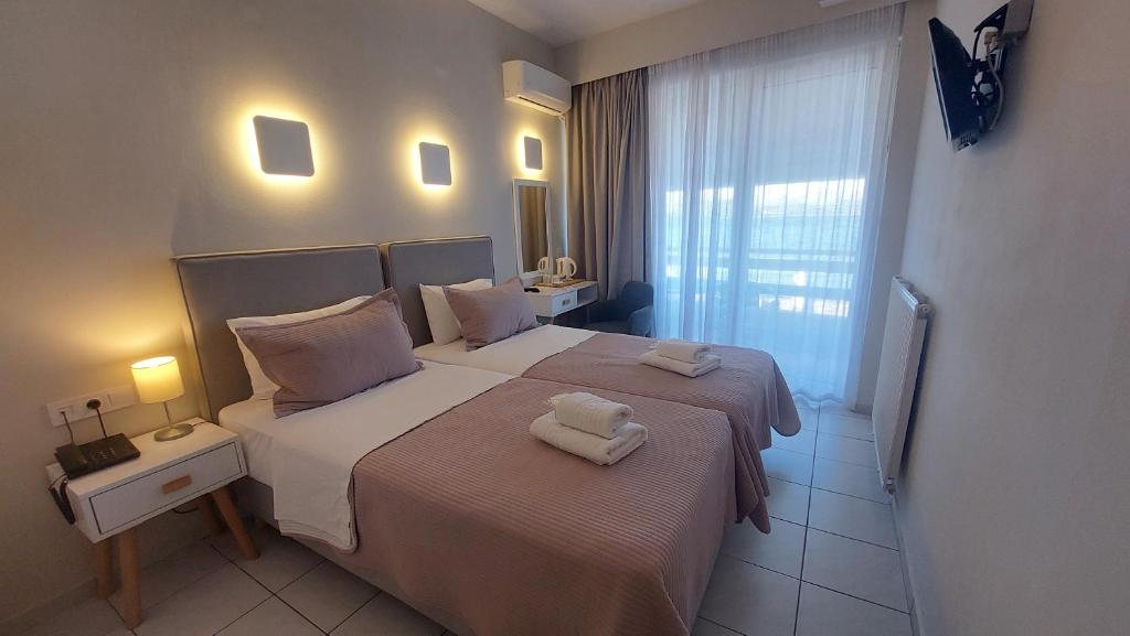 Postel nebo postele na pokoji v ubytování Hotel Avra