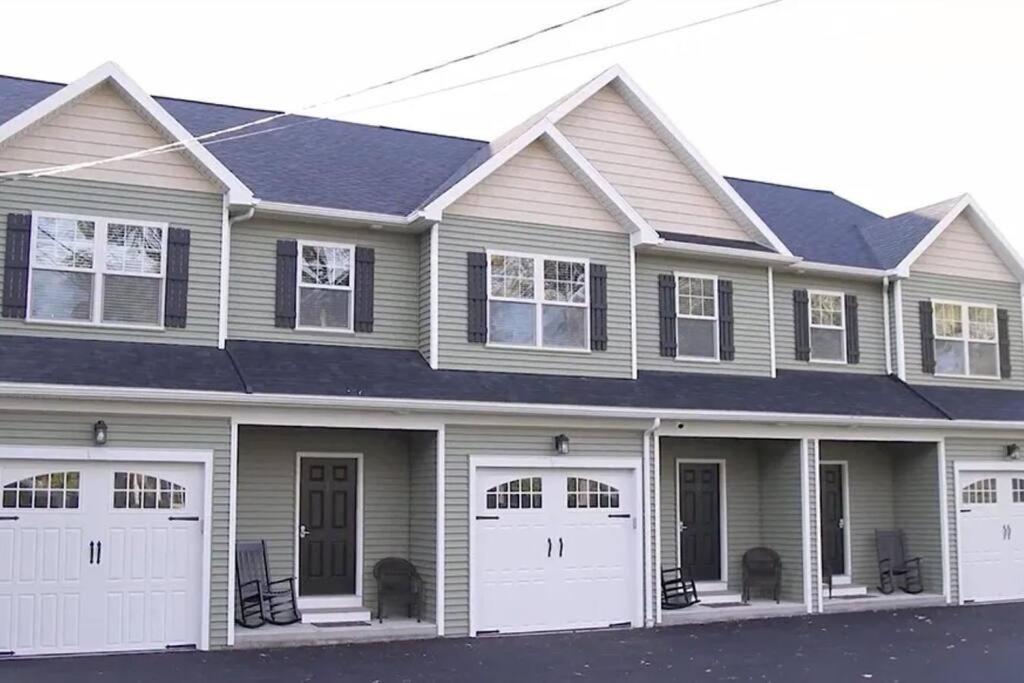 a large house with two garages at Three Schooners Landing Condo 2 in Sodus Point