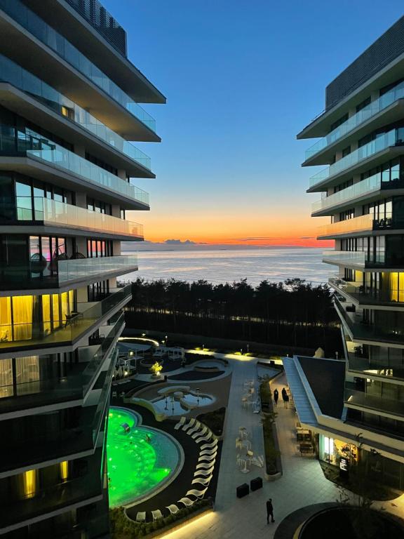 a view from a building at sunset at Apartamenty Sea Towers SeaView by Rent like home in Międzyzdroje