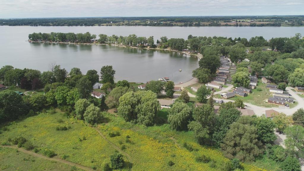 an aerial view of a lake with trees and a park at 3 Bedroom Cottage Beachview Lane 35 in Cherry Valley