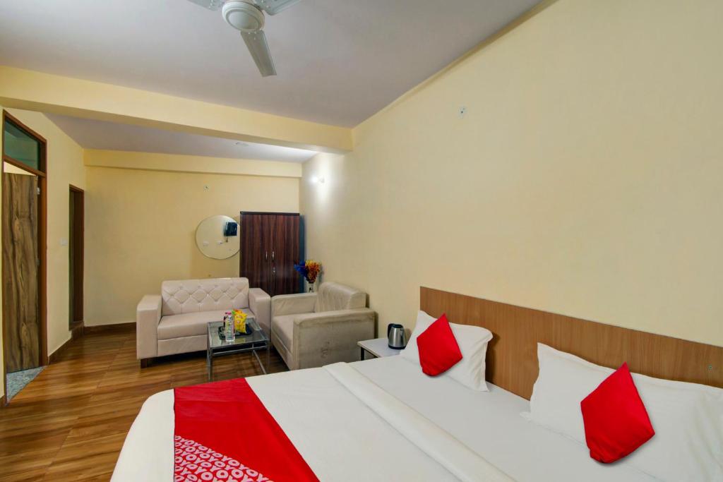 a bedroom with a bed and a living room at Super OYOHotel Silver Stay 02 in Jaipur