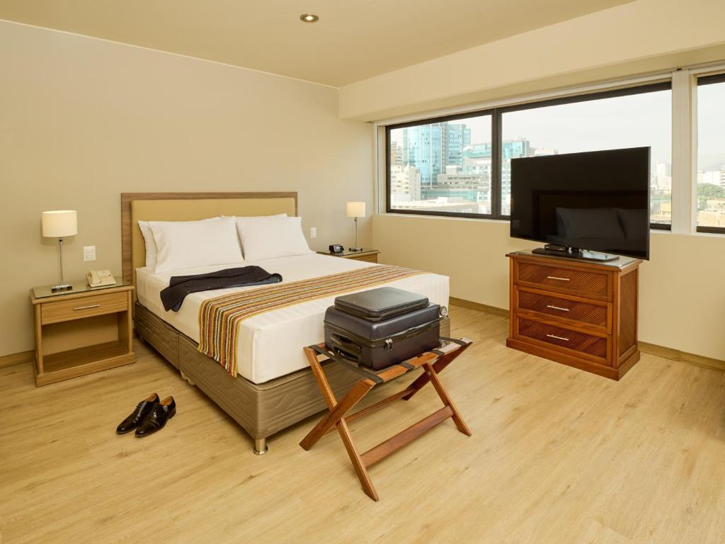 A bed or beds in a room at Estelar Apartamentos Bellavista