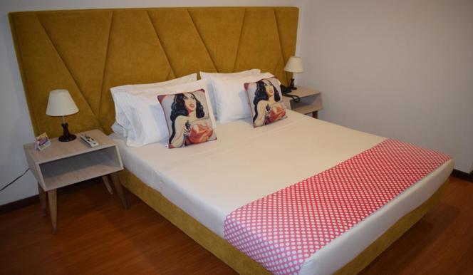 Postel nebo postele na pokoji v ubytování Pop Art Hotel Las Colinas Manizales