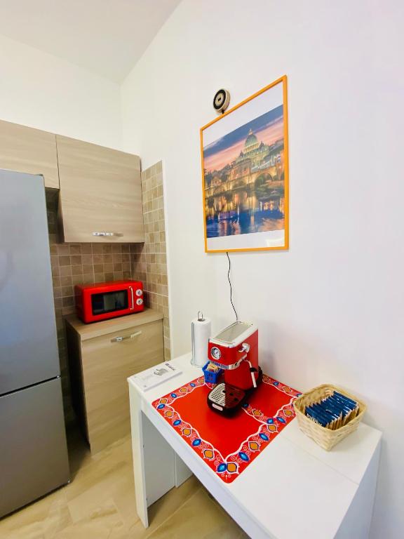 Kuchyň nebo kuchyňský kout v ubytování Way2Rome Apartments