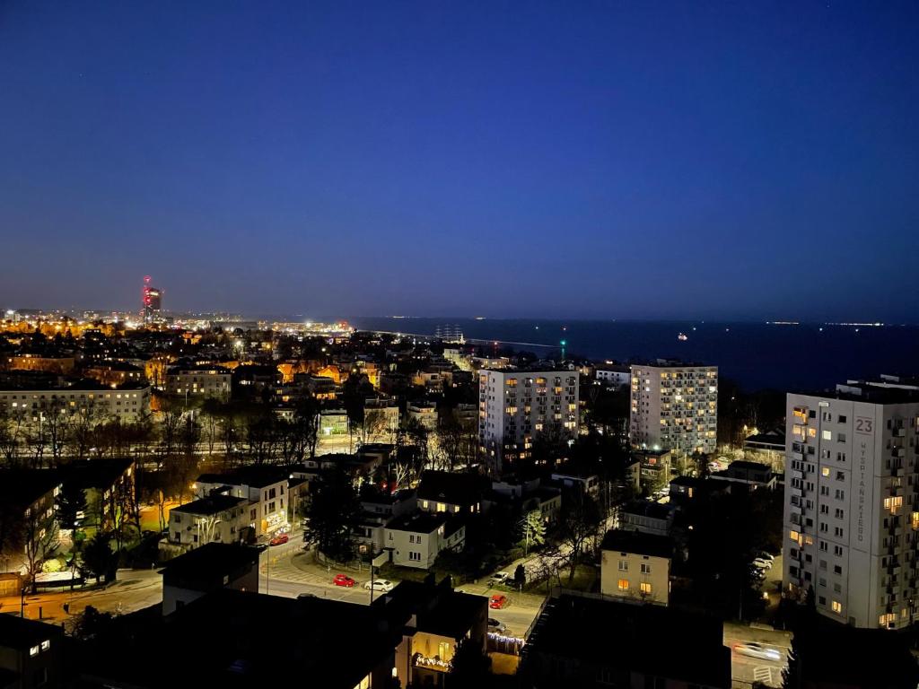 a view of a city at night at Gdynia Riviera Hills in Gdynia