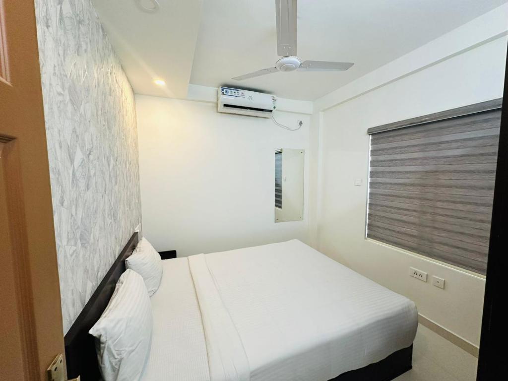 Postel nebo postele na pokoji v ubytování Nujoom Apartments