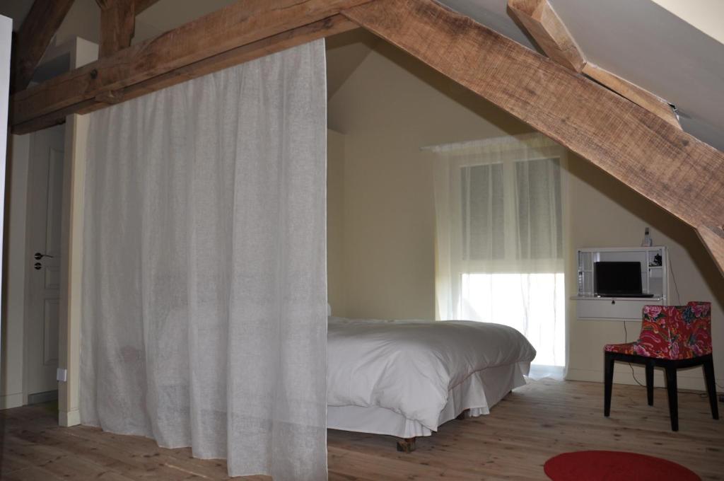 Postel nebo postele na pokoji v ubytování Le Mas Capel