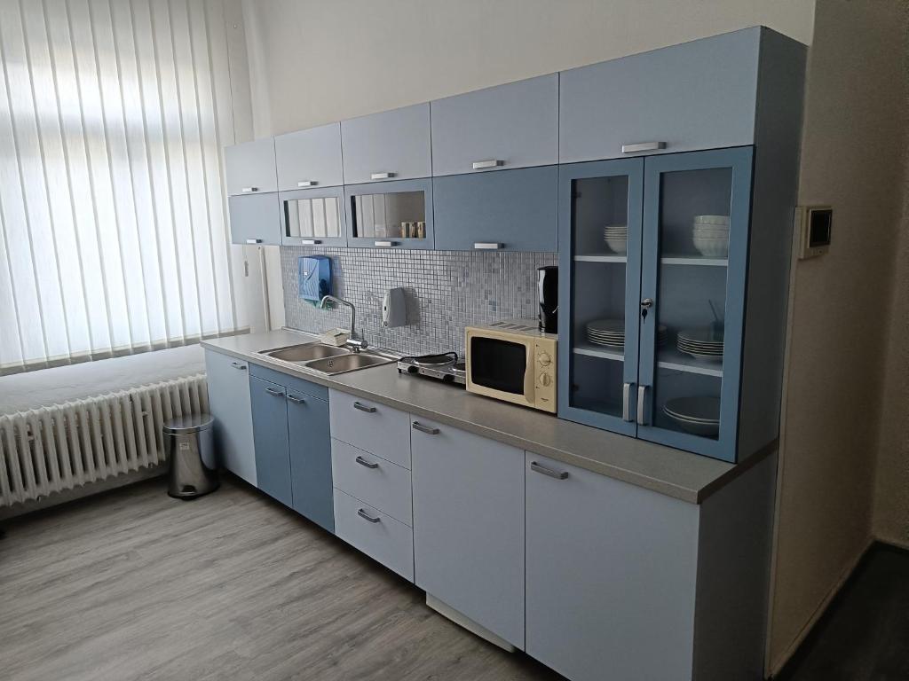 Kuchyň nebo kuchyňský kout v ubytování Apartment 6