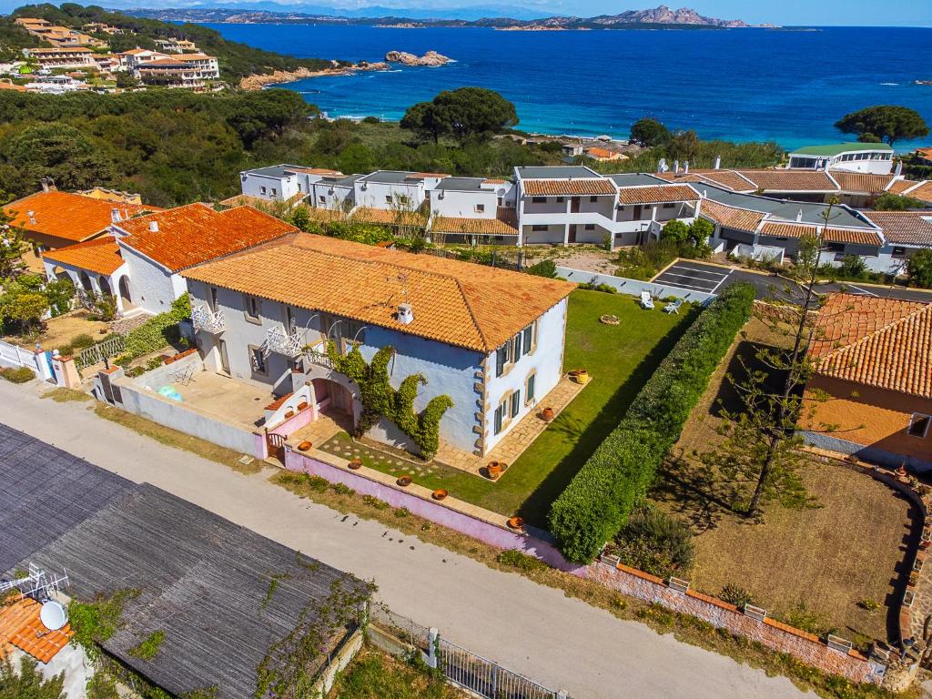 an aerial view of a house with a yard at Sardinia Family Villas Villa Lucrezia in Baja Sardinia