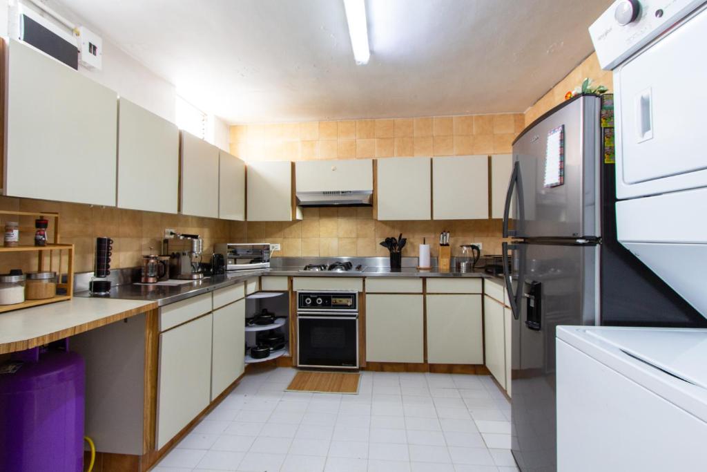 Kuchyň nebo kuchyňský kout v ubytování CoNomad House - Coliving & Coworking