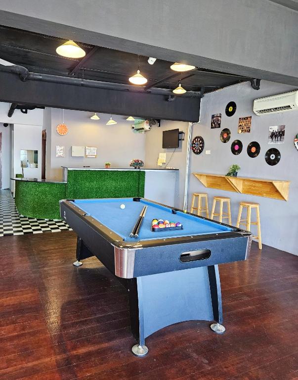 a ping pong table in a room with a pool table at The 60 in George Town