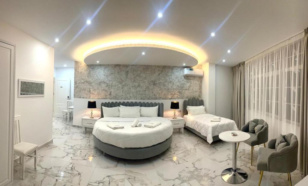 Posteľ alebo postele v izbe v ubytovaní UJVARA HOTEL