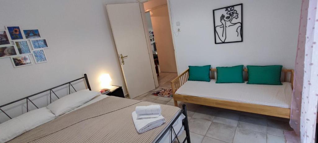 Postel nebo postele na pokoji v ubytování Makis Apartments Flogita