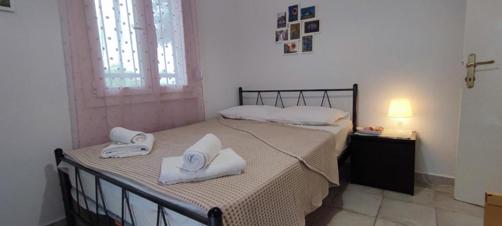Postel nebo postele na pokoji v ubytování Makis Apartments Flogita
