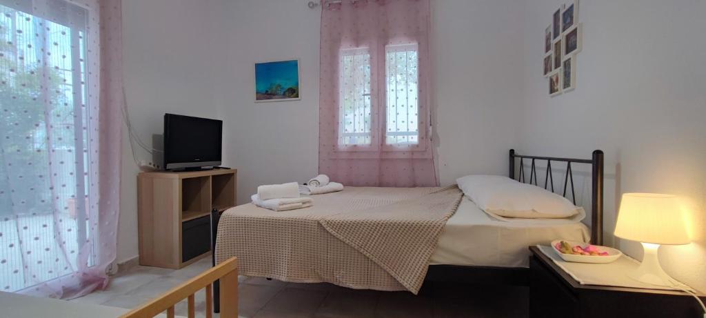 Postel nebo postele na pokoji v ubytování Makis Apartments Flogita