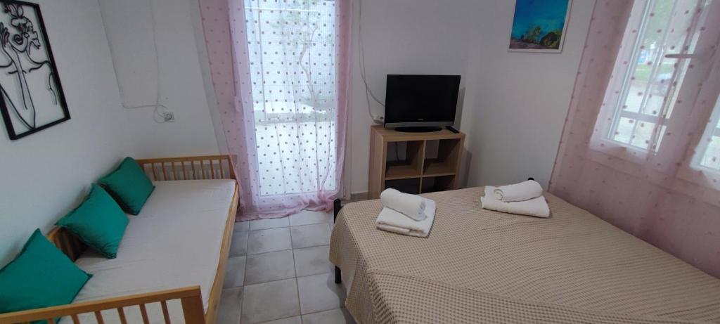 Postel nebo postele na pokoji v ubytování Makis Apartments Flogita