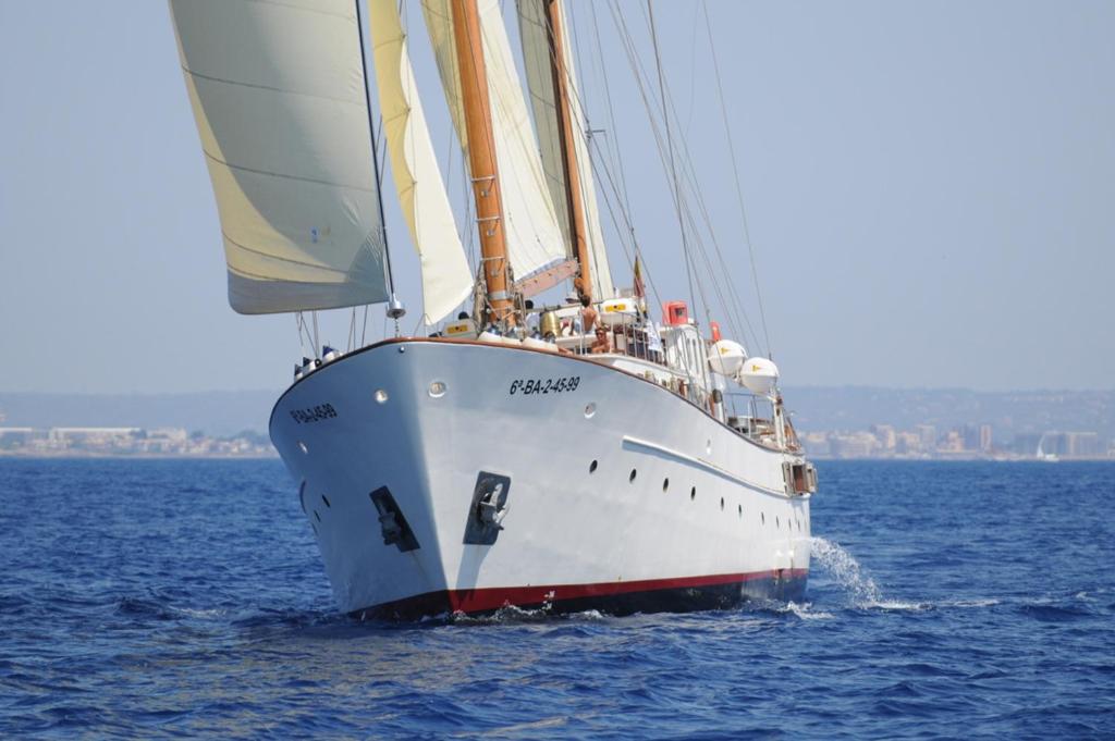 a white sail boat in the water at Southern Cross in Barcelona