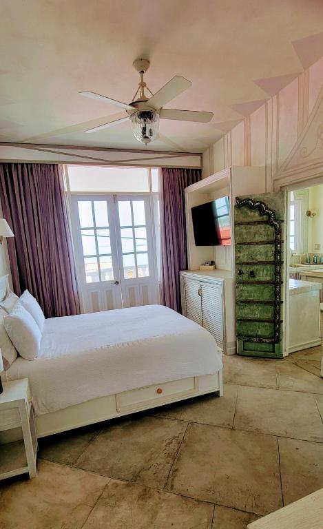 Postel nebo postele na pokoji v ubytování Villa Caprichosa Boutique Hotels