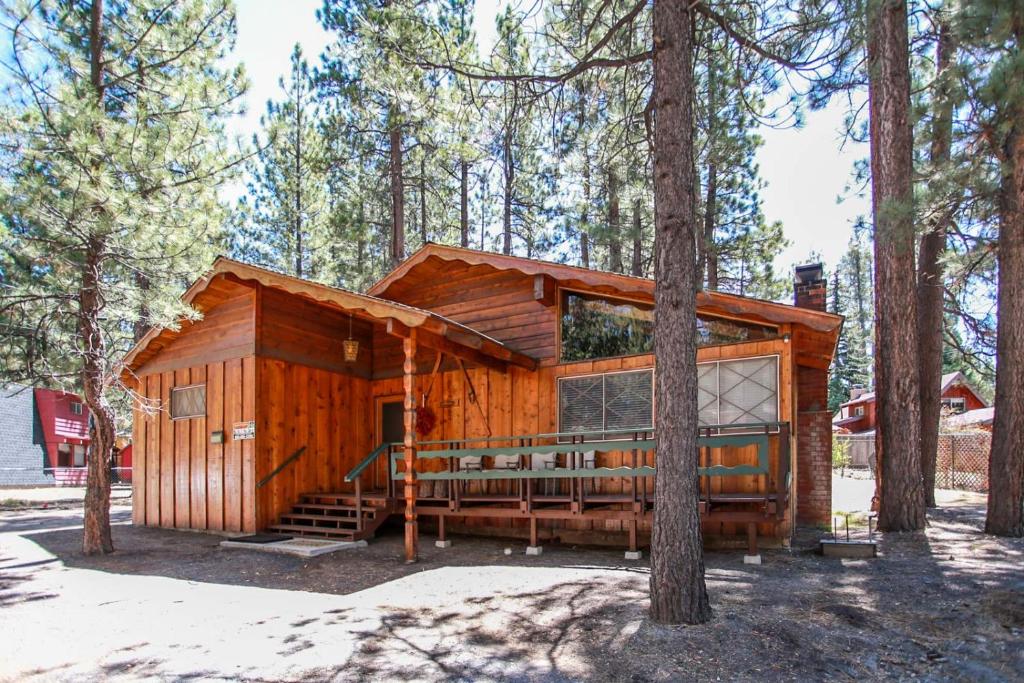 a log cabin in the woods with a large porch at Avalon hide out #1336 in Big Bear Lake