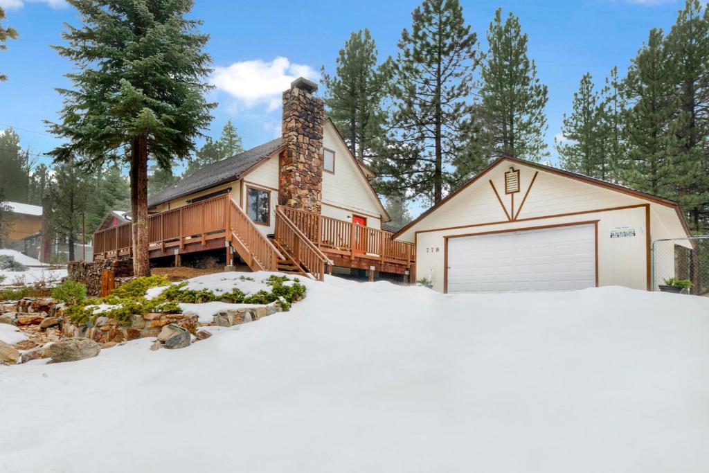 a house with a garage in the snow at Swiss delight #2244 in Big Bear Lake