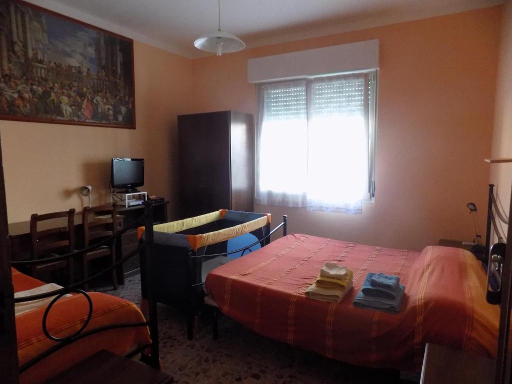 Postel nebo postele na pokoji v ubytování B&B Falcone