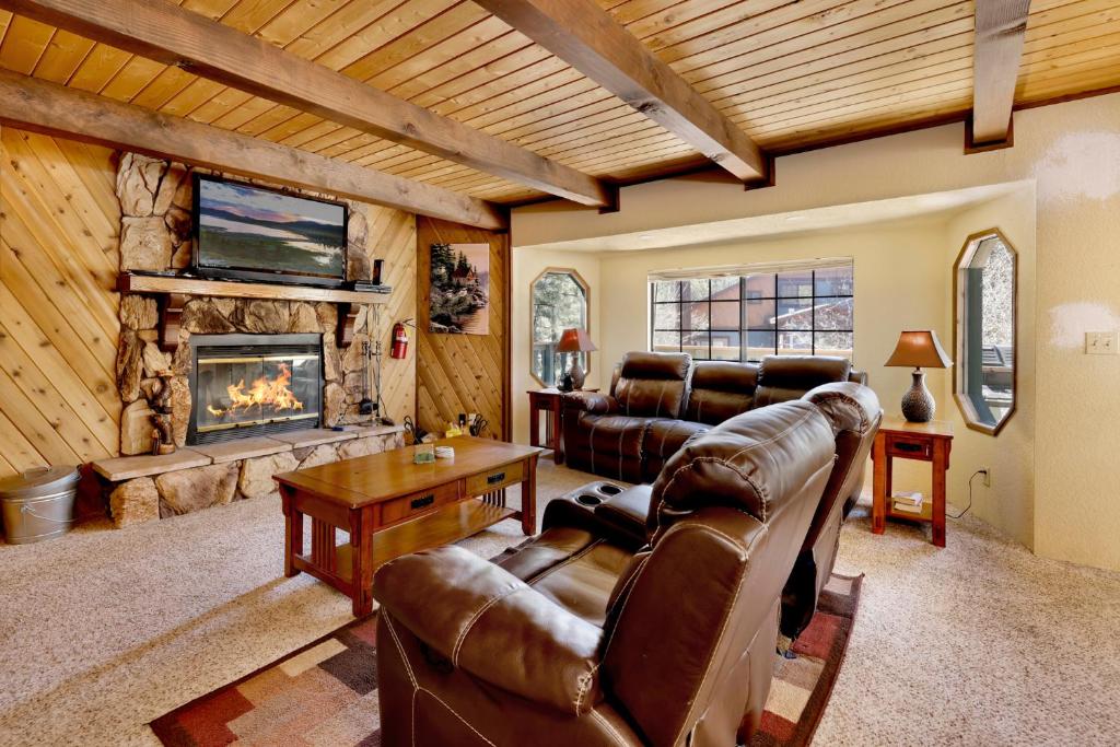 a living room with a couch and a fireplace at Midnight howl #1536 in Big Bear Lake