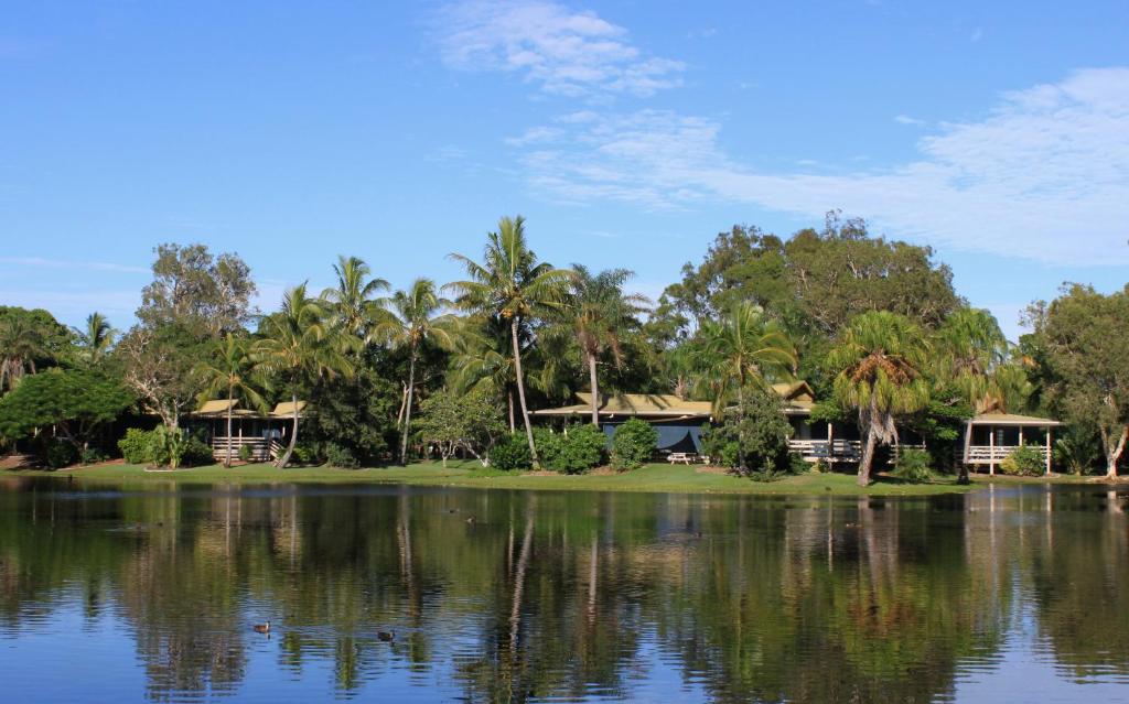 a large body of water with trees at Sanctuary Lakes Fauna Retreat in Hervey Bay
