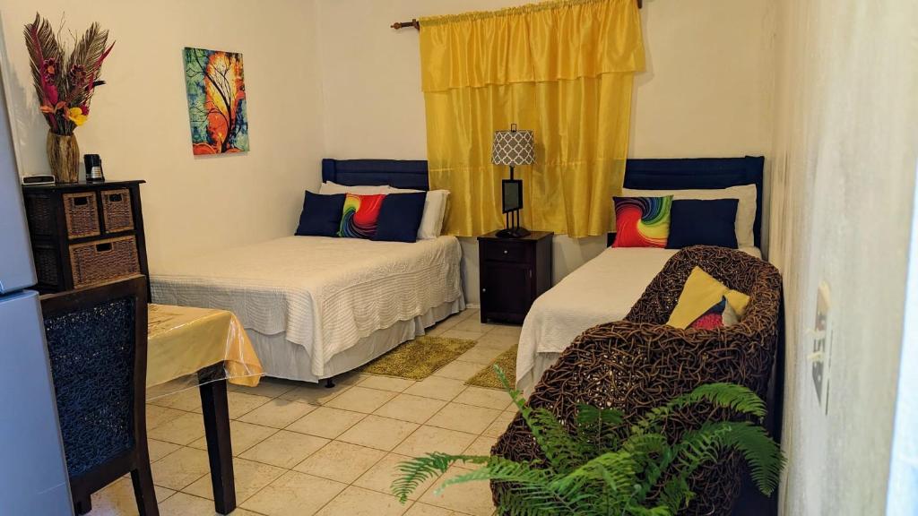 Llit o llits en una habitació de Native Vybz