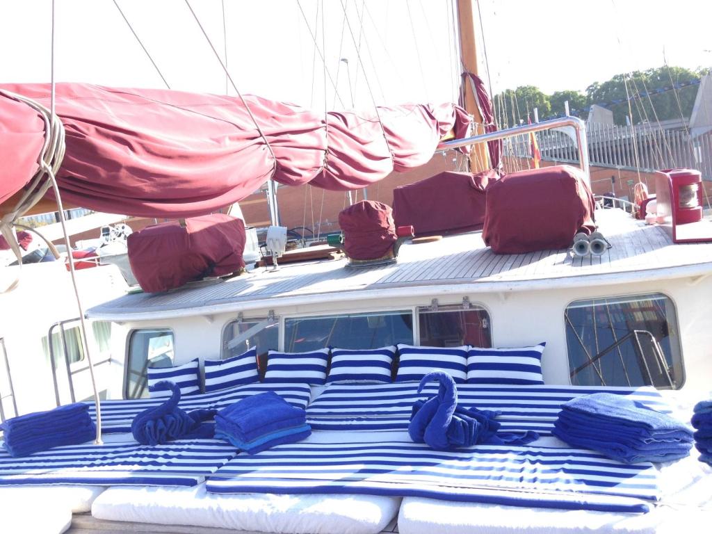 a boat with blue pillows on top of it at Southern Cross in Barcelona