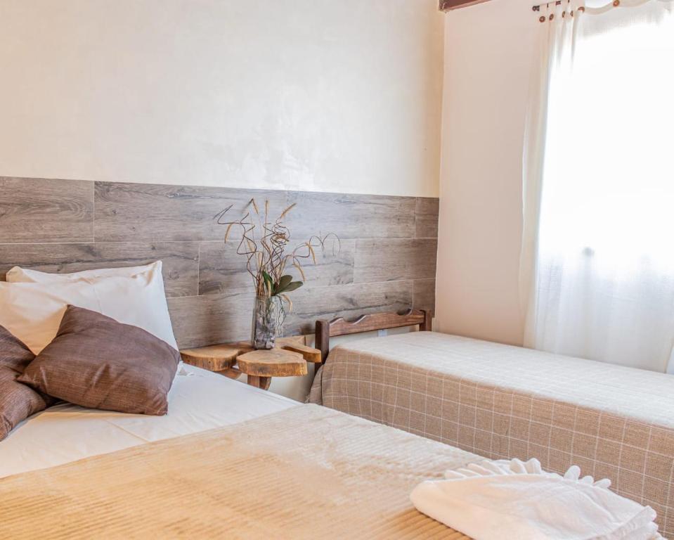 Uma cama ou camas num quarto em Pousada Das Araras