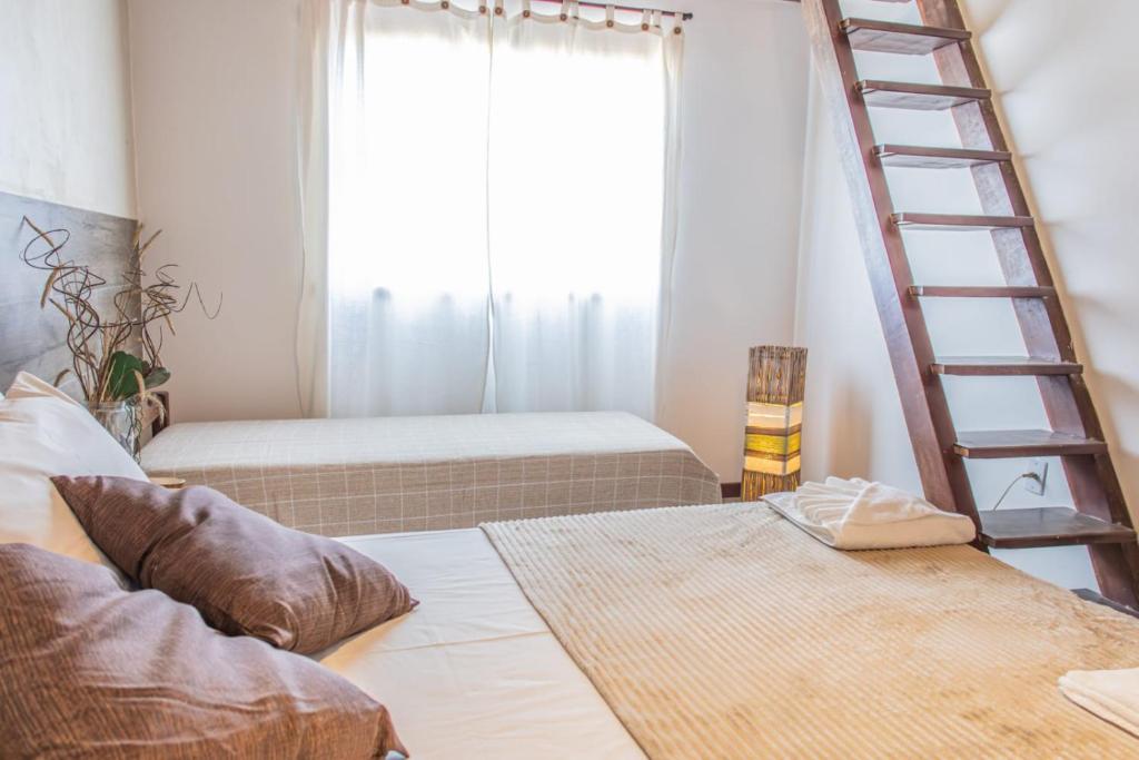Uma cama ou camas num quarto em Pousada Das Araras