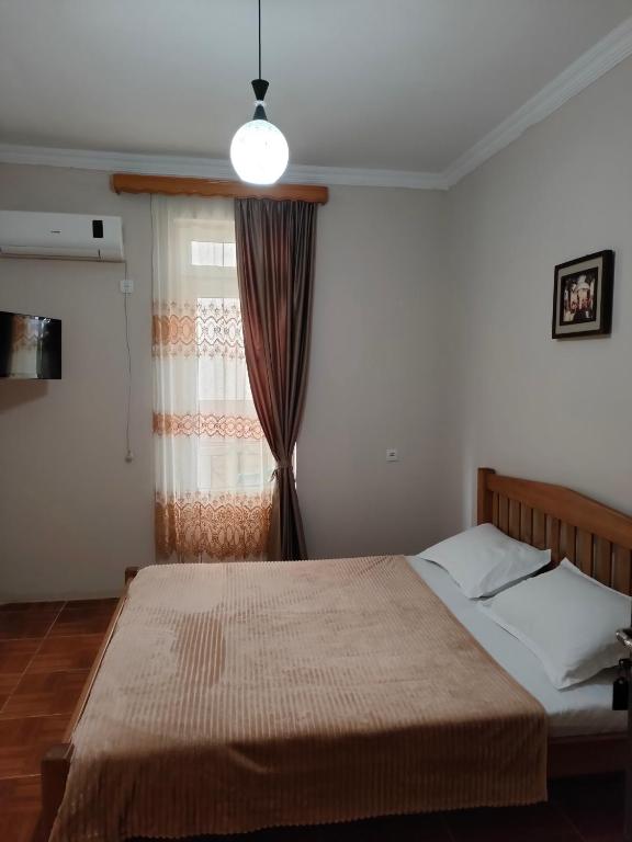 Postel nebo postele na pokoji v ubytování Tornado Hotel