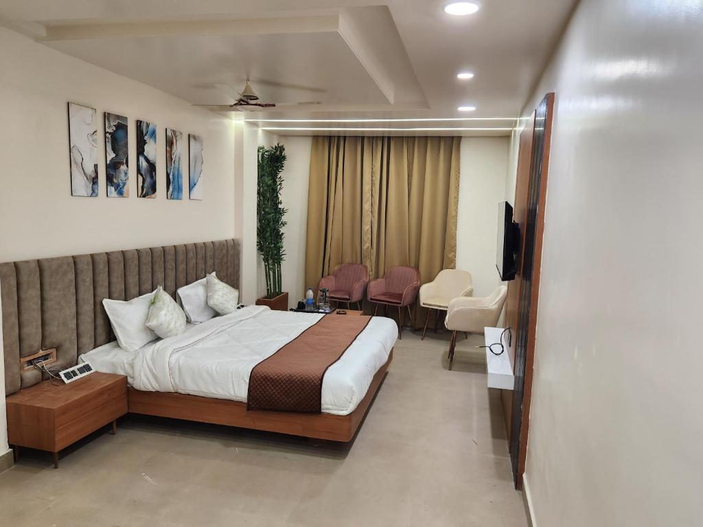 Postelja oz. postelje v sobi nastanitve Hotel Shrinath Casa Inn