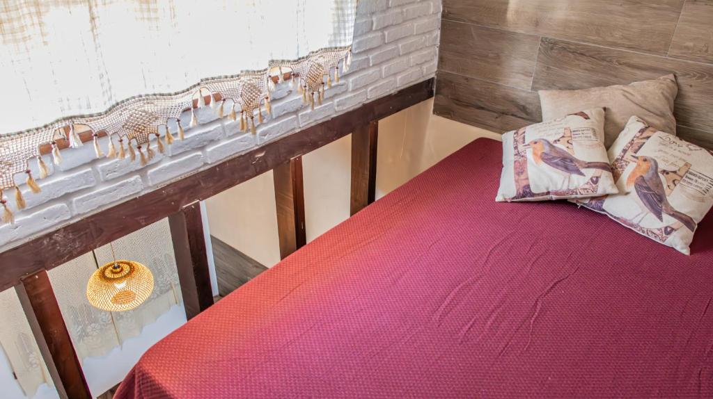 Uma cama ou camas num quarto em Pousada Das Araras