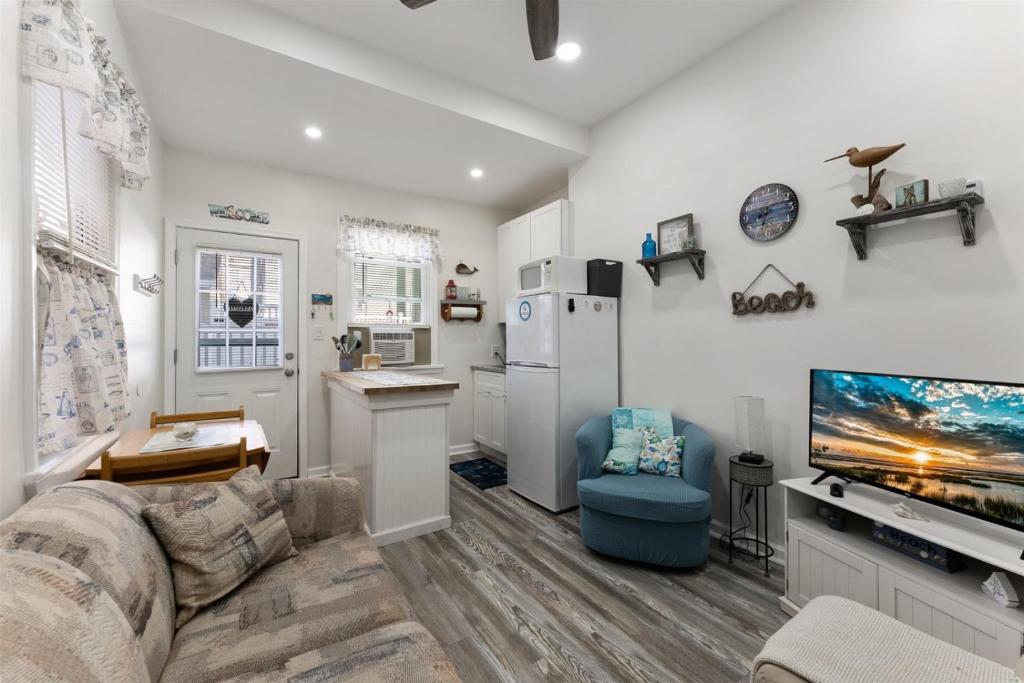 a living room with a couch and a flat screen tv at 5600 Seaview Ave, Unit 15 in Wildwood Crest