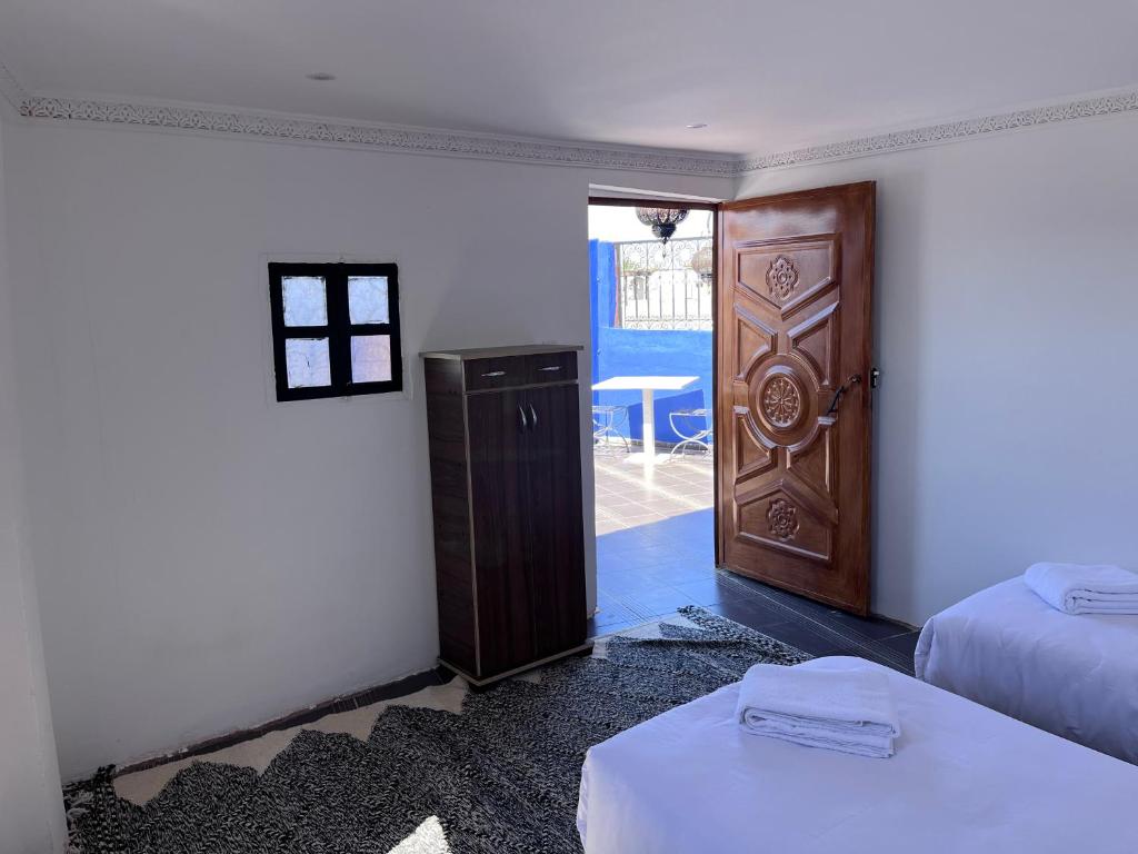 Postel nebo postele na pokoji v ubytování Riad Dar Zarbia