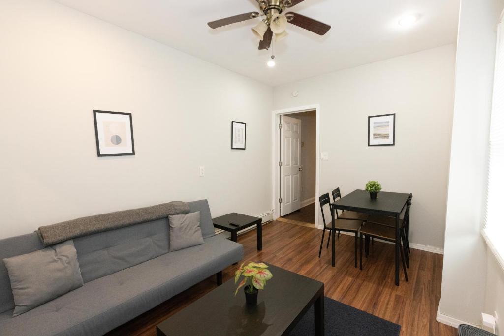 a living room with a couch and a table at 3-Bed Luxurious Home Close to NYC in Jersey City