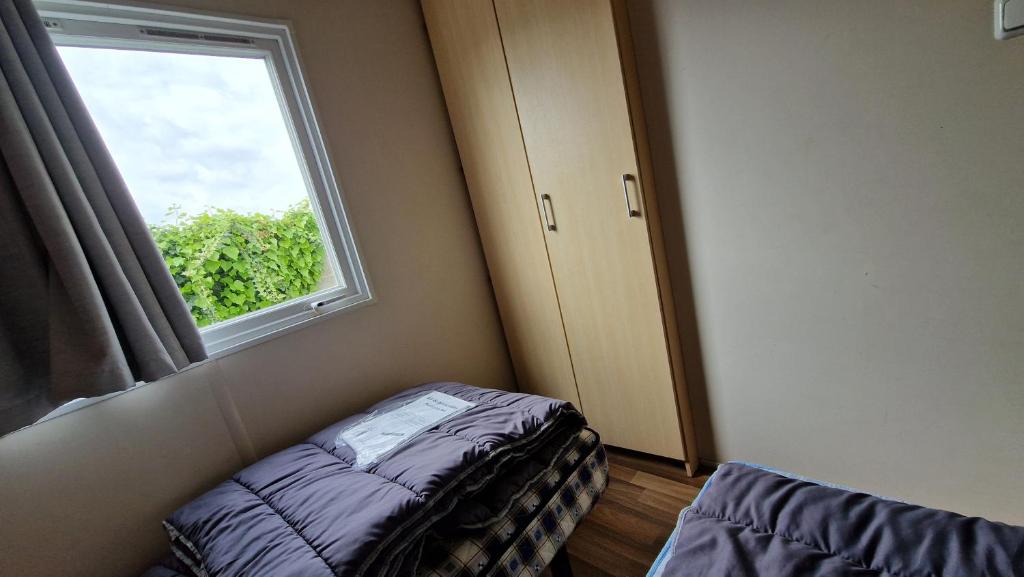 Postel nebo postele na pokoji v ubytování EGELE MOBILE-HOME prox Europapark et Rulantica