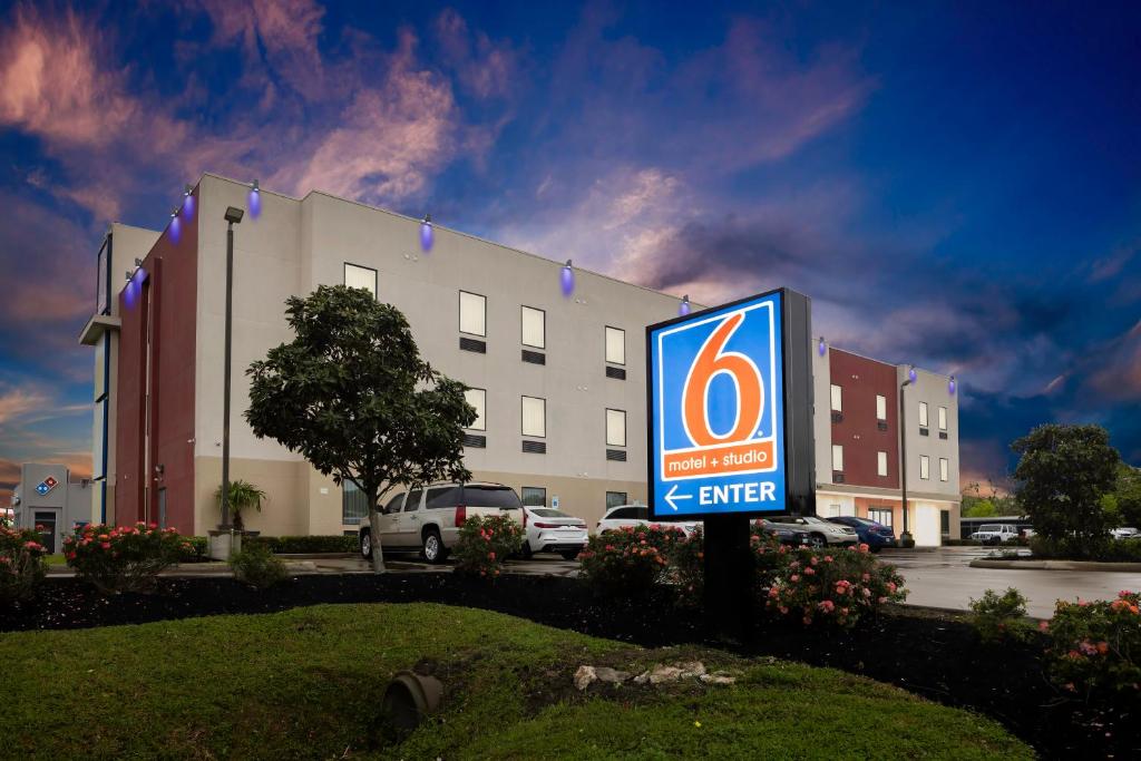 a building with a sign in front of it at Studio 6 Suites Texas City I-45 in Texas City