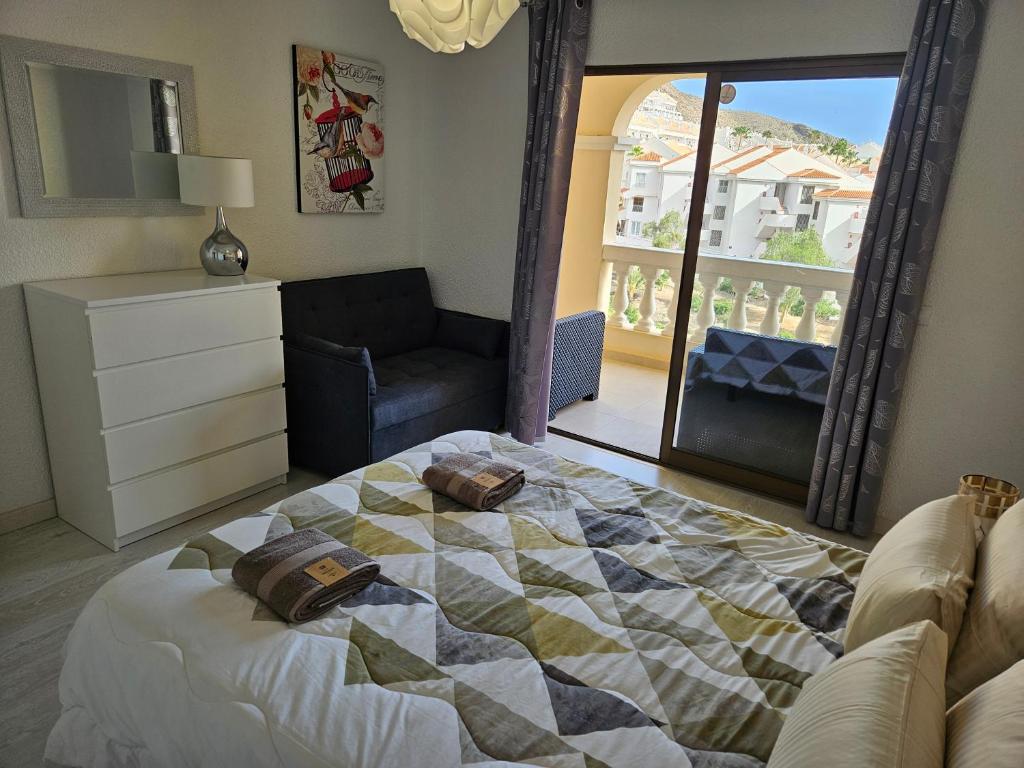 Кровать или кровати в номере Los Cristianos Heated Pool Sea View AC