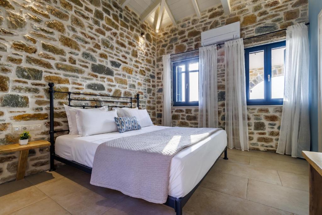 A bed or beds in a room at RODON Luxury Villas