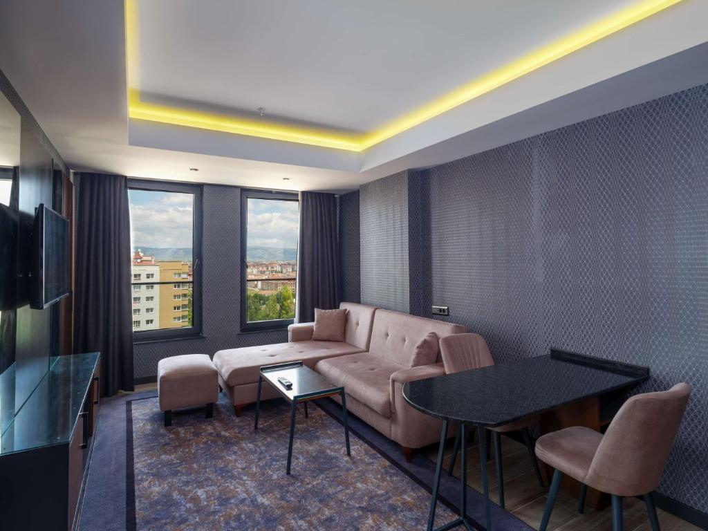 Posezení v ubytování Nova Vista Deluxe & Suites a Member of Radisson Individuals
