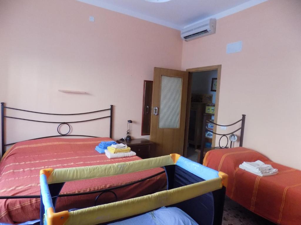 Postel nebo postele na pokoji v ubytování B&B Falcone